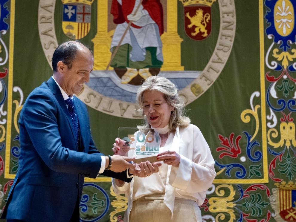 El consejero de Sanidad, José Luis Bancalero Flores, y la gerente del 061 Aragón, Marta Sampériz, asisten al acto institucional del 25º aniversario de la creación del servicio de Urgencias y Emergencias sanitarias 061.